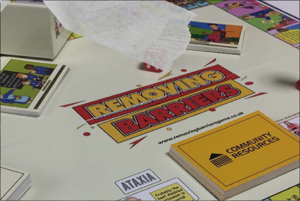 Photograph of satirical postcards by artist Dave Lupton created during the disability rights movement.