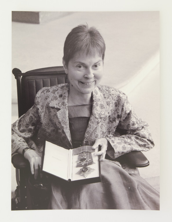 Baroness Jane Campbell holds her Dame Commander of the British Empire medal (DBE)