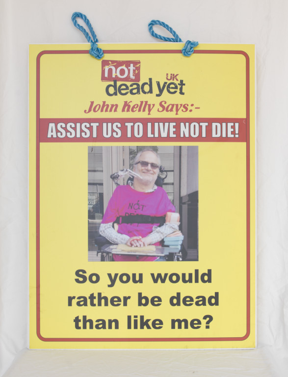 NOT DEAD YET PLACARD – John Kelly